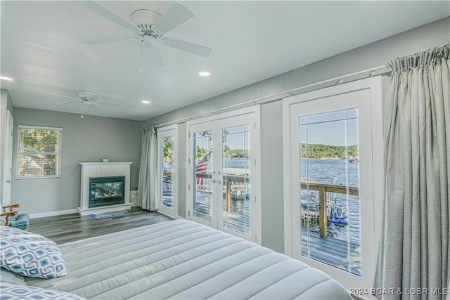 bedroom featuring hardwood / wood-style flooring, ceiling fan, french doors, and access to exterior