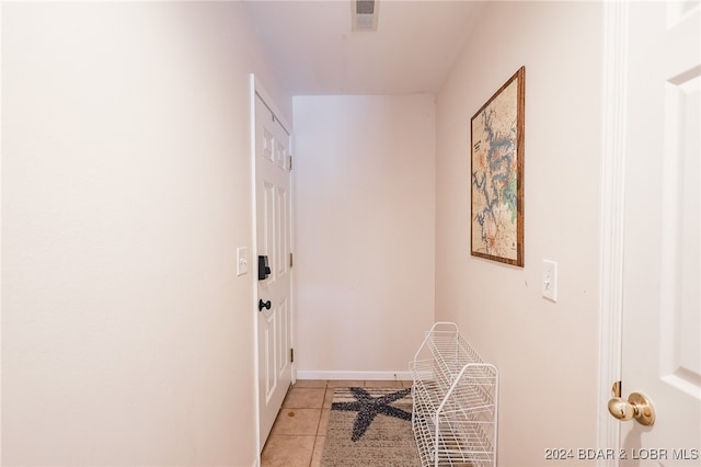 hallway with light tile patterned floors