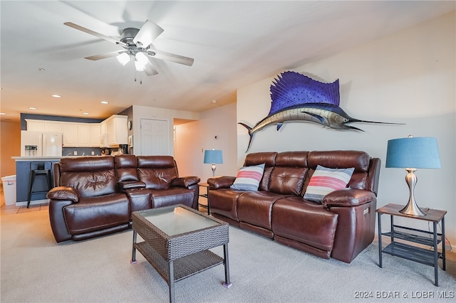 living room with light carpet and ceiling fan