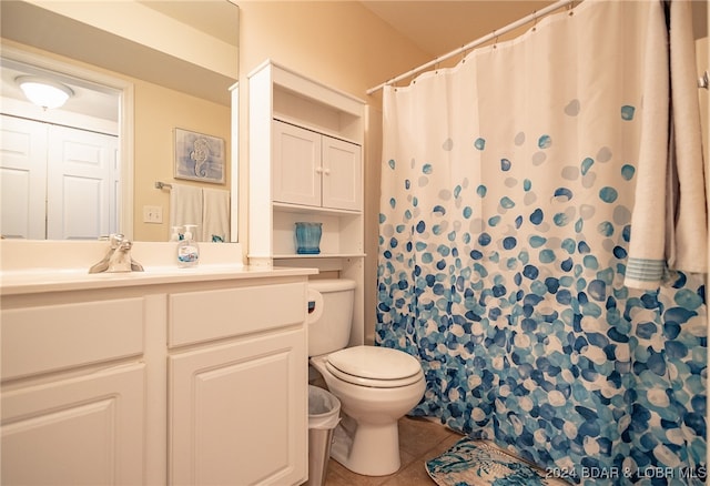 bathroom with tile patterned flooring, vanity, toilet, and a shower with curtain