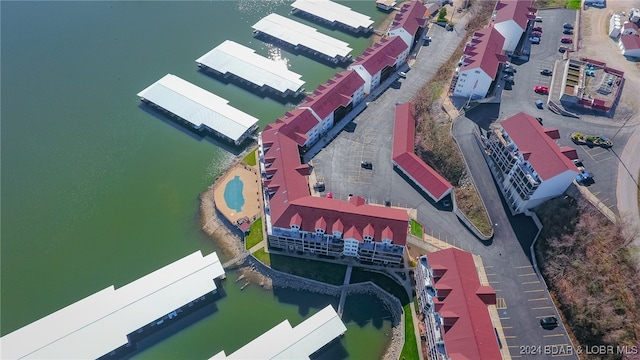 birds eye view of property with a water view