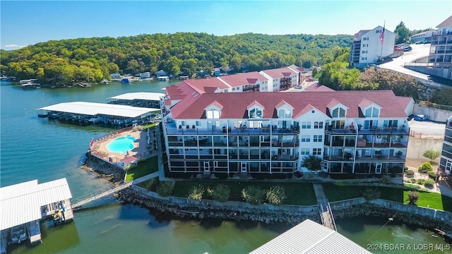 birds eye view of property with a water view