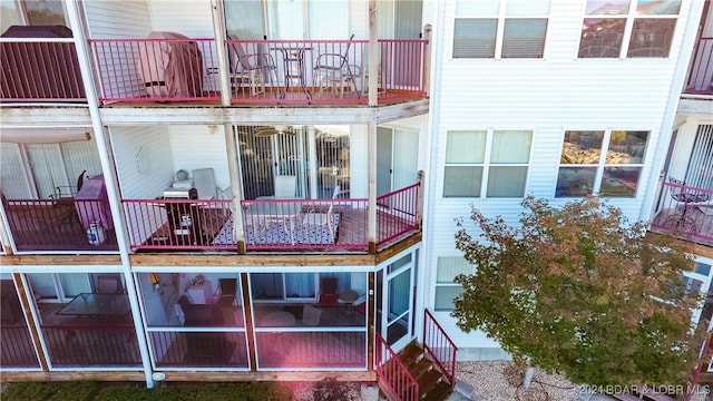 rear view of property featuring a balcony