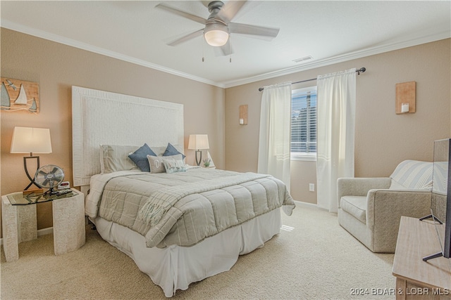 carpeted bedroom featuring ornamental molding and ceiling fan