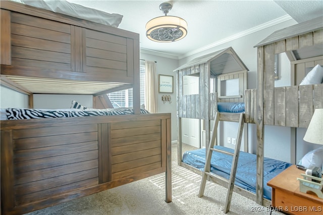 carpeted bedroom featuring ornamental molding