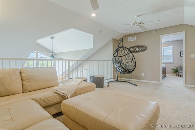 living room featuring carpet floors, lofted ceiling, and ceiling fan