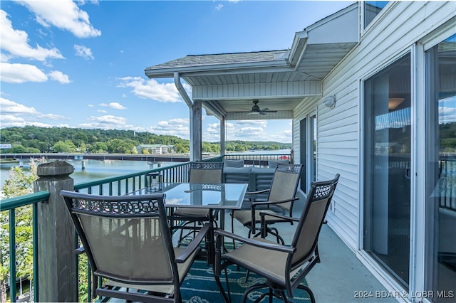 wooden terrace featuring ceiling fan