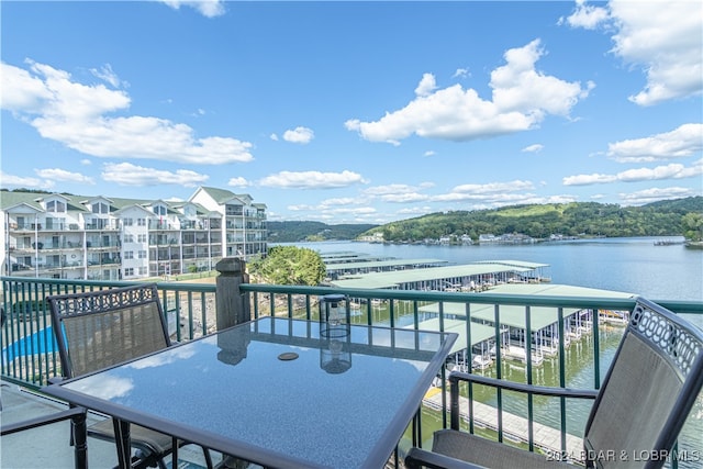 balcony featuring a water view