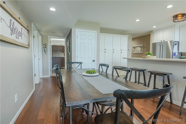 dining space with dark wood-type flooring