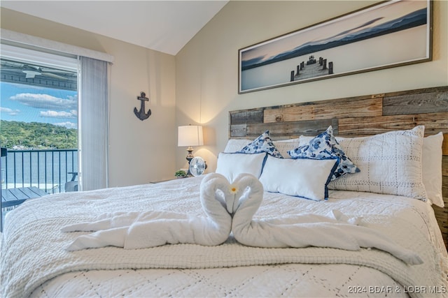 bedroom featuring vaulted ceiling and access to exterior