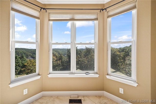 unfurnished sunroom with a wealth of natural light