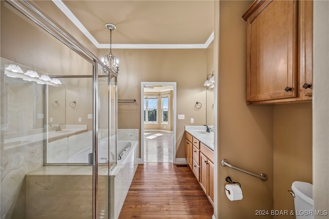 full bathroom featuring vanity, crown molding, wood-type flooring, separate shower and tub, and toilet