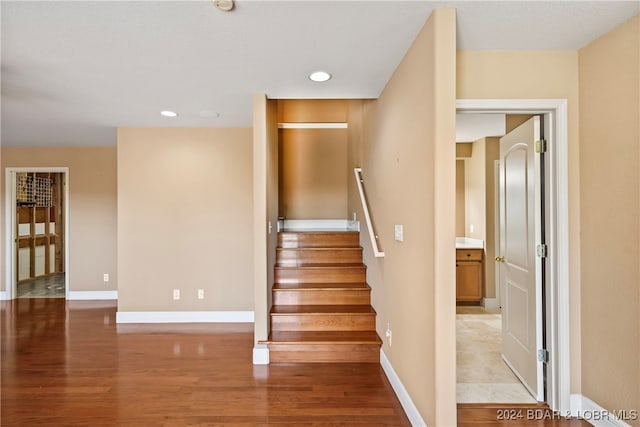 stairs with hardwood / wood-style flooring