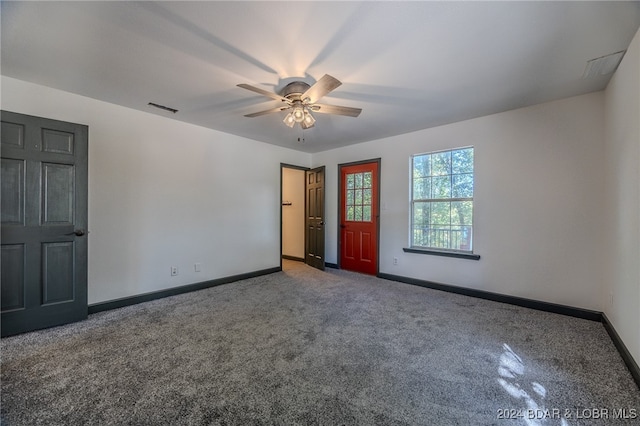 unfurnished bedroom featuring carpet floors and ceiling fan