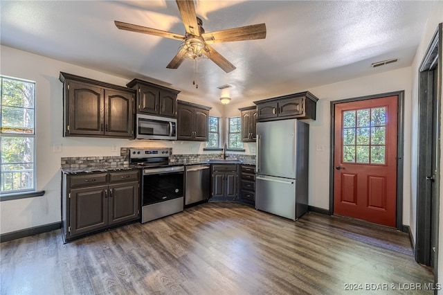 kitchen featuring a wealth of natural light, appliances with stainless steel finishes, and sink