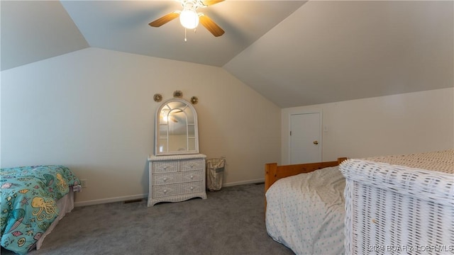 carpeted bedroom with ceiling fan, baseboards, and vaulted ceiling