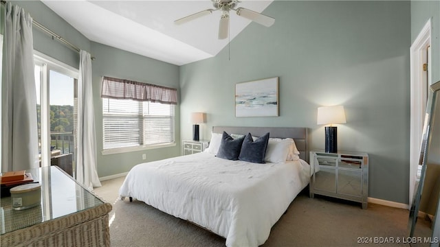 carpeted bedroom with a ceiling fan, lofted ceiling, and baseboards