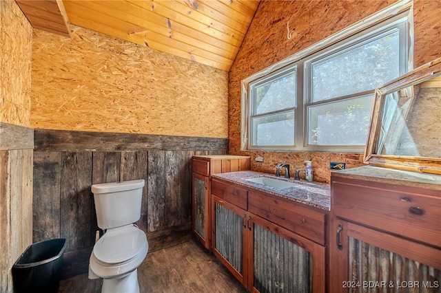 bathroom with vanity, vaulted ceiling, hardwood / wood-style flooring, toilet, and wood ceiling