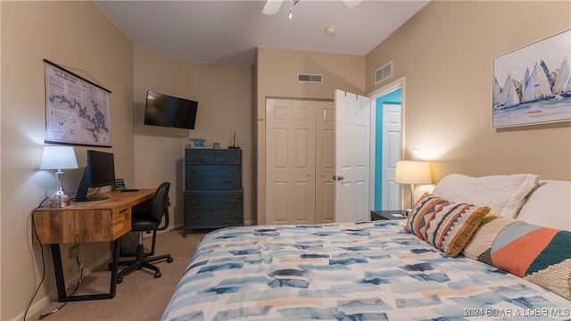 bedroom with light carpet, a closet, and ceiling fan