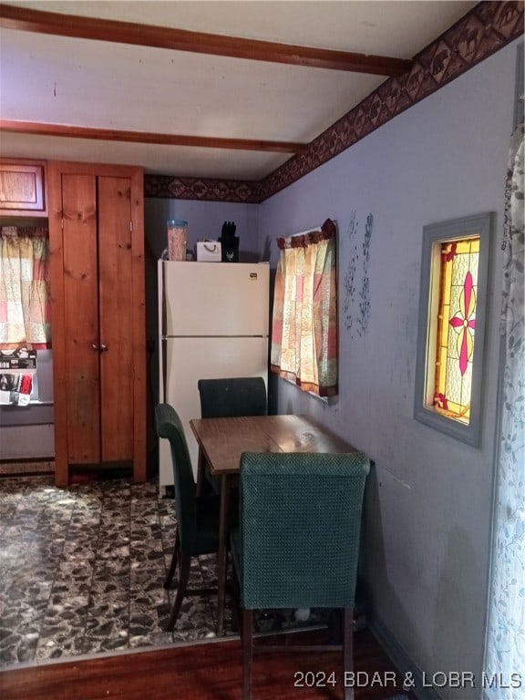 dining space with hardwood / wood-style flooring