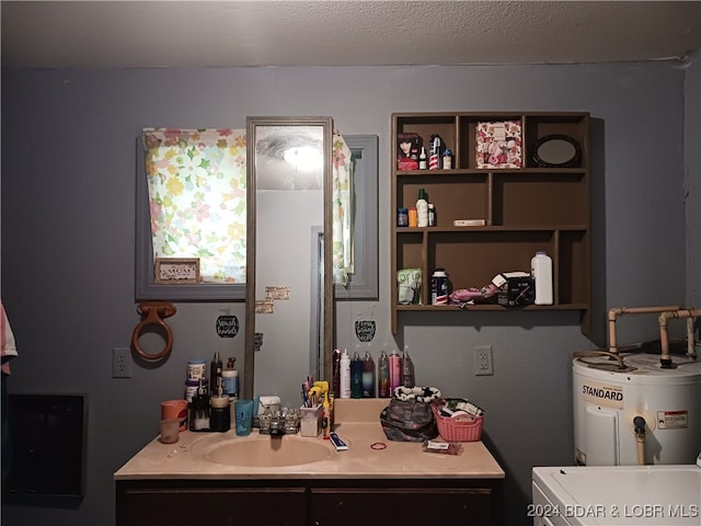 bathroom with vanity, water heater, and a textured ceiling