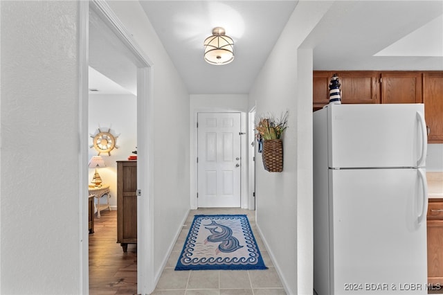 hallway with light tile patterned flooring