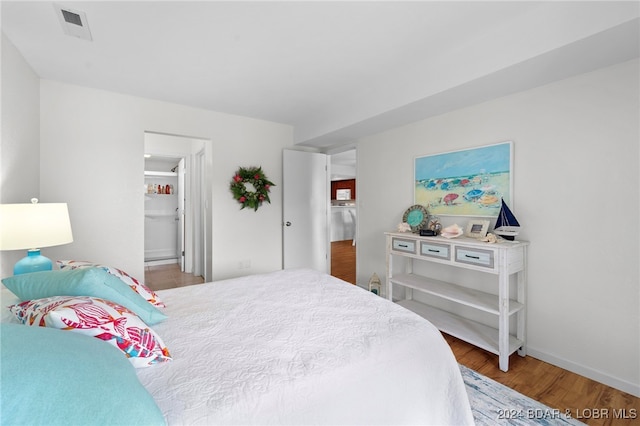 bedroom with wood-type flooring