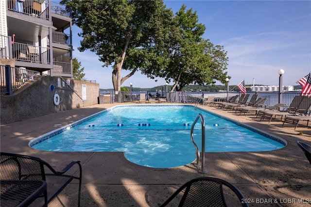 view of pool featuring a patio