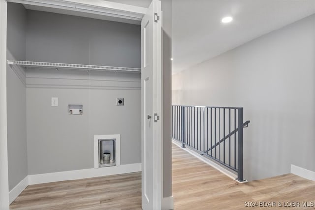 washroom featuring washer hookup, hardwood / wood-style flooring, and electric dryer hookup