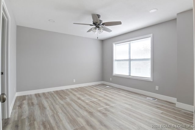 unfurnished room with light hardwood / wood-style flooring and ceiling fan