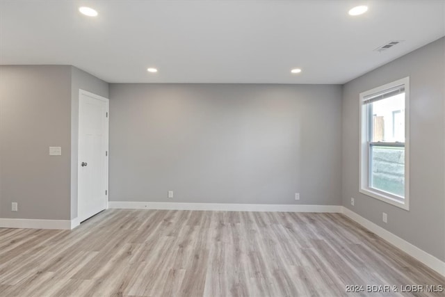 unfurnished room featuring light wood-type flooring