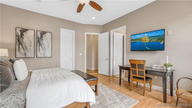 bedroom with ceiling fan and wood-type flooring