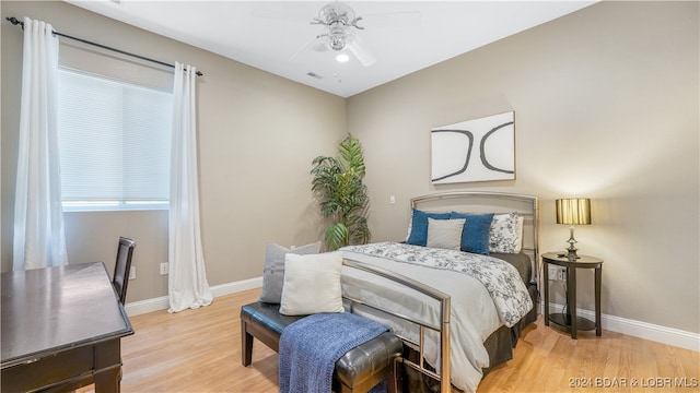 bedroom featuring hardwood / wood-style floors and ceiling fan