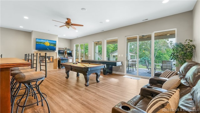 playroom featuring light wood-type flooring, billiards, ceiling fan, and a healthy amount of sunlight