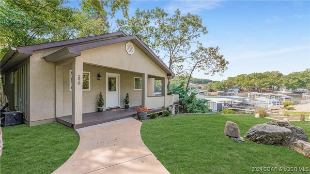 view of front of home with a front lawn and covered porch