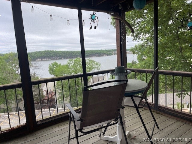 deck featuring a water view