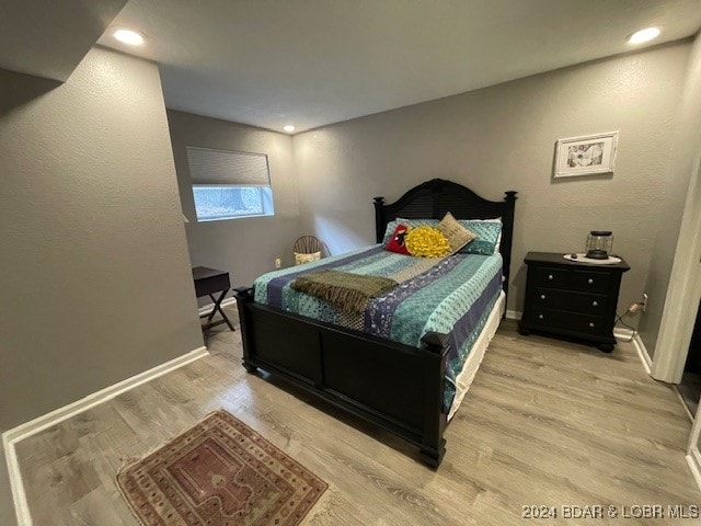 bedroom featuring light hardwood / wood-style floors