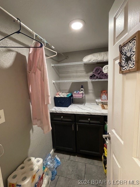 walk in closet featuring light tile patterned floors