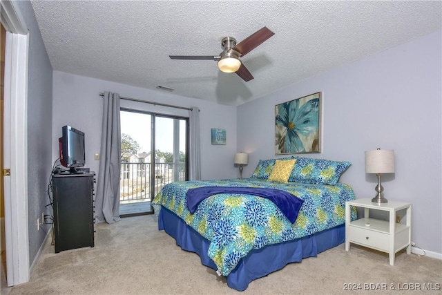 803 Winn Rd Unit 7E, Osage Beach, MO 65065 - bedroom featuring access to outside, carpet flooring, a textured ceiling, and ceiling fan