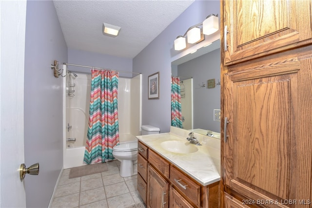 full bathroom with vanity, tile patterned flooring, a textured ceiling, shower / bath combo with shower curtain, and toilet