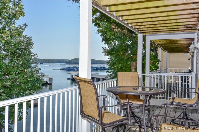 balcony featuring a water view