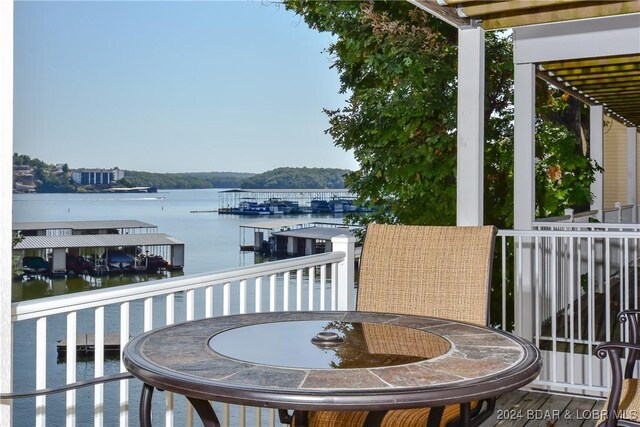 balcony featuring a water view