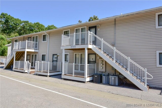 rear view of property with central air condition unit