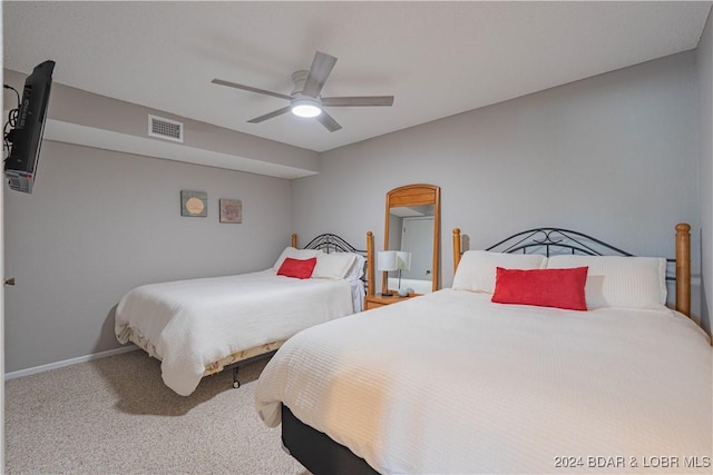 bedroom with ceiling fan and carpet flooring