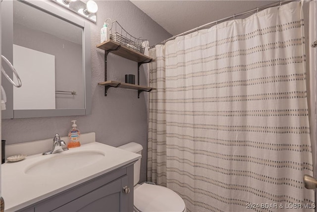 bathroom featuring vanity, toilet, and a shower with shower curtain