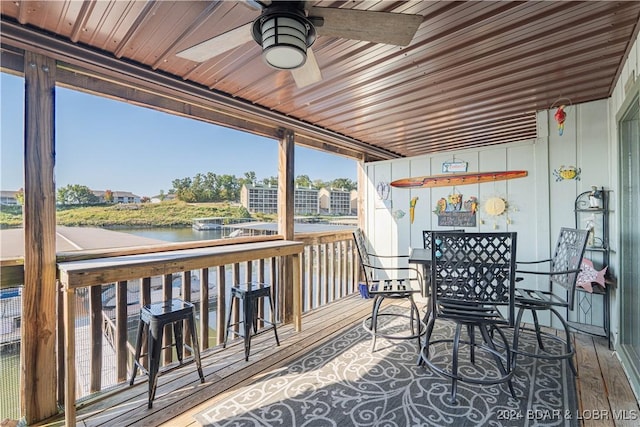 wooden terrace with a water view