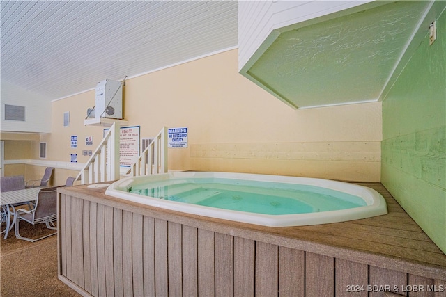 view of pool featuring an indoor hot tub