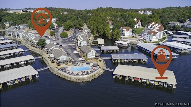 birds eye view of property featuring a water view