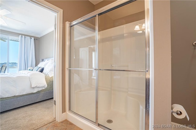 full bath featuring a shower stall, ceiling fan, crown molding, and ensuite bathroom