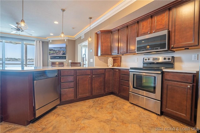 kitchen featuring light countertops, appliances with stainless steel finishes, a peninsula, and hanging light fixtures